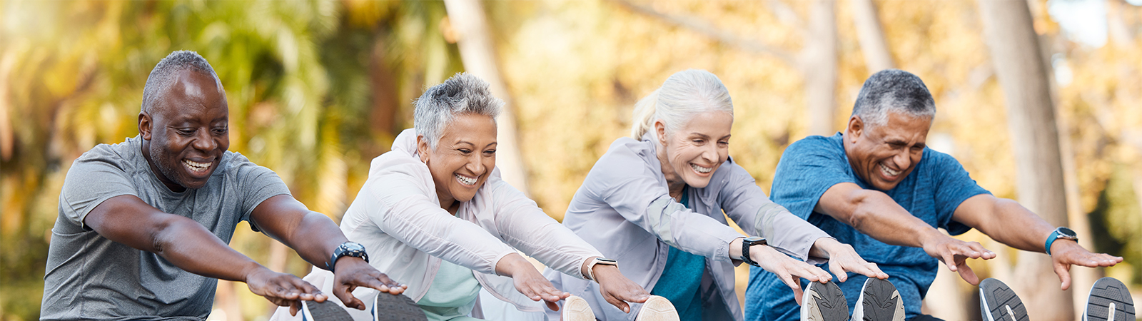 Multiracial senior fitness group stretching in park, promoting healthy aging, mobility and resilience