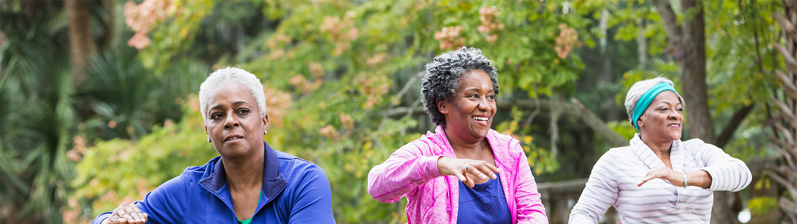 Active senior women doing functional fitness exercises outdoors, showcasing healthy aging and resilience